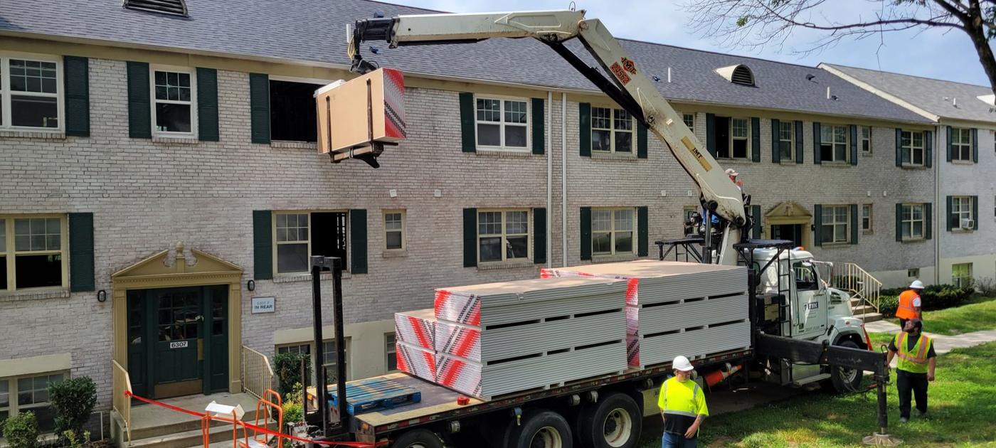 Crane delivery to a rooftop job site